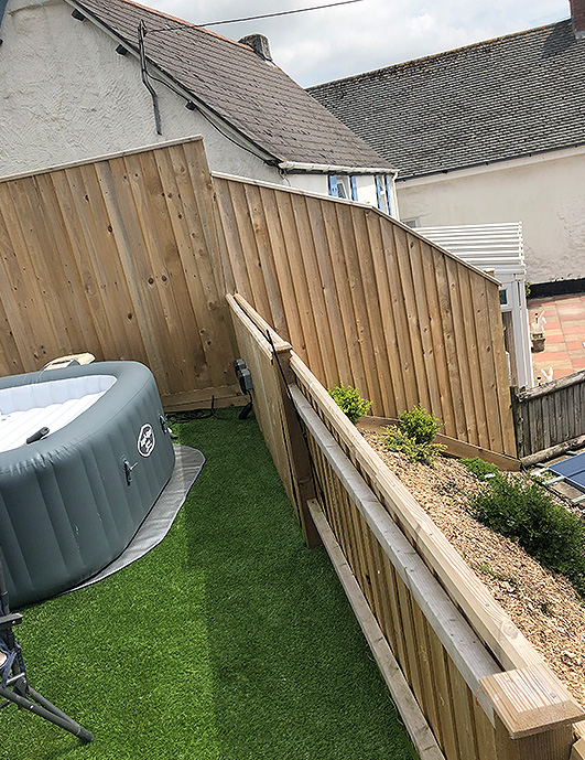New timber panel fence with gate installed by St Ives Fencing Services